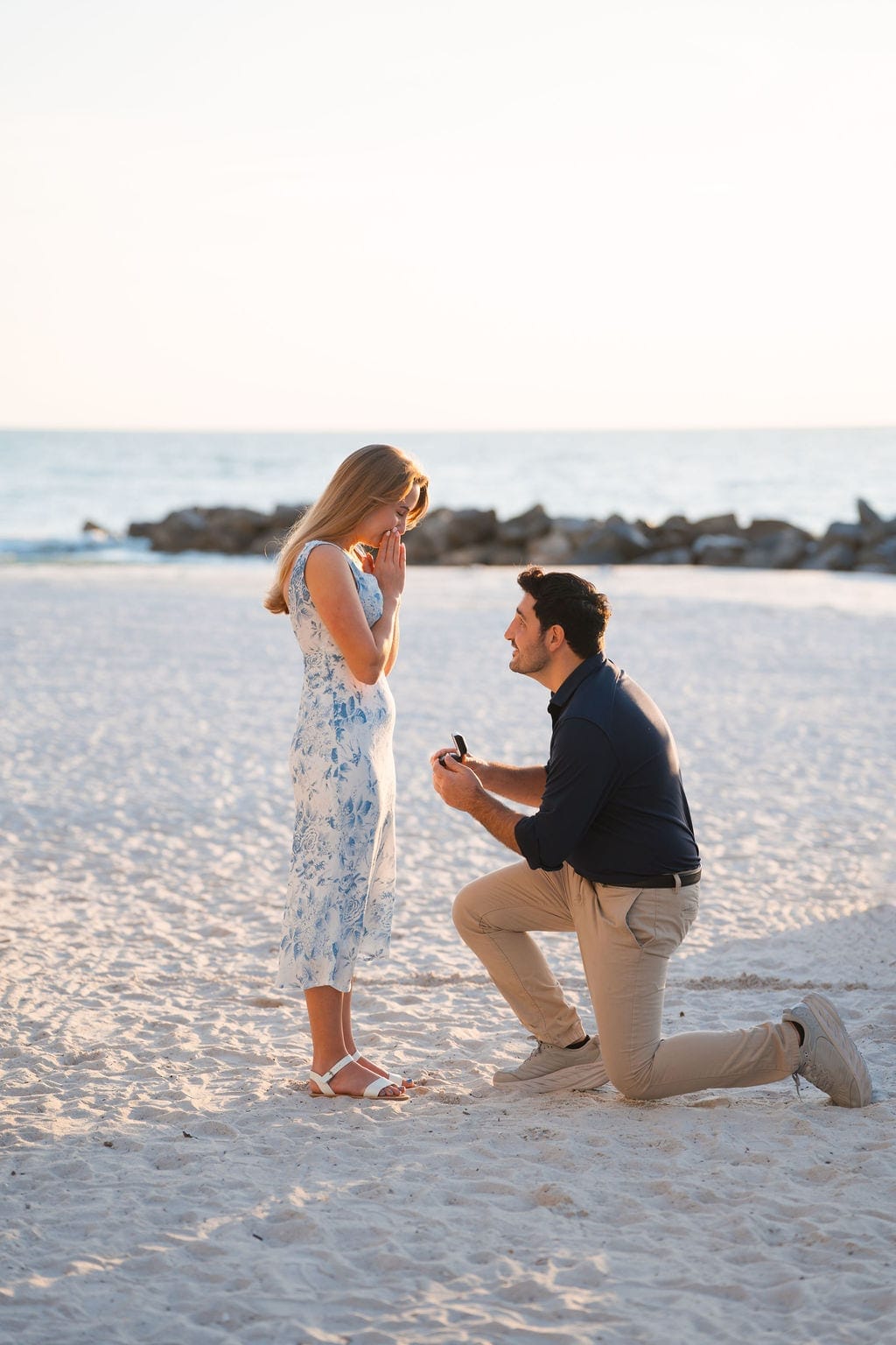 Surprise beach proposal on one knee with ring box Florida