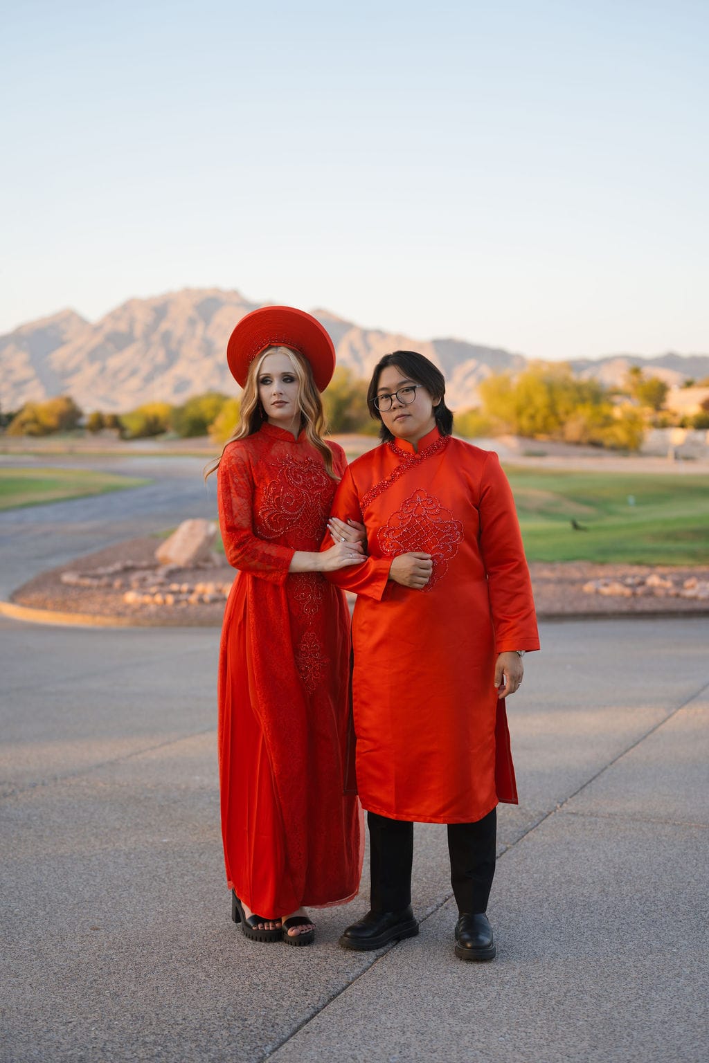 Couple red ao dai desert mountains