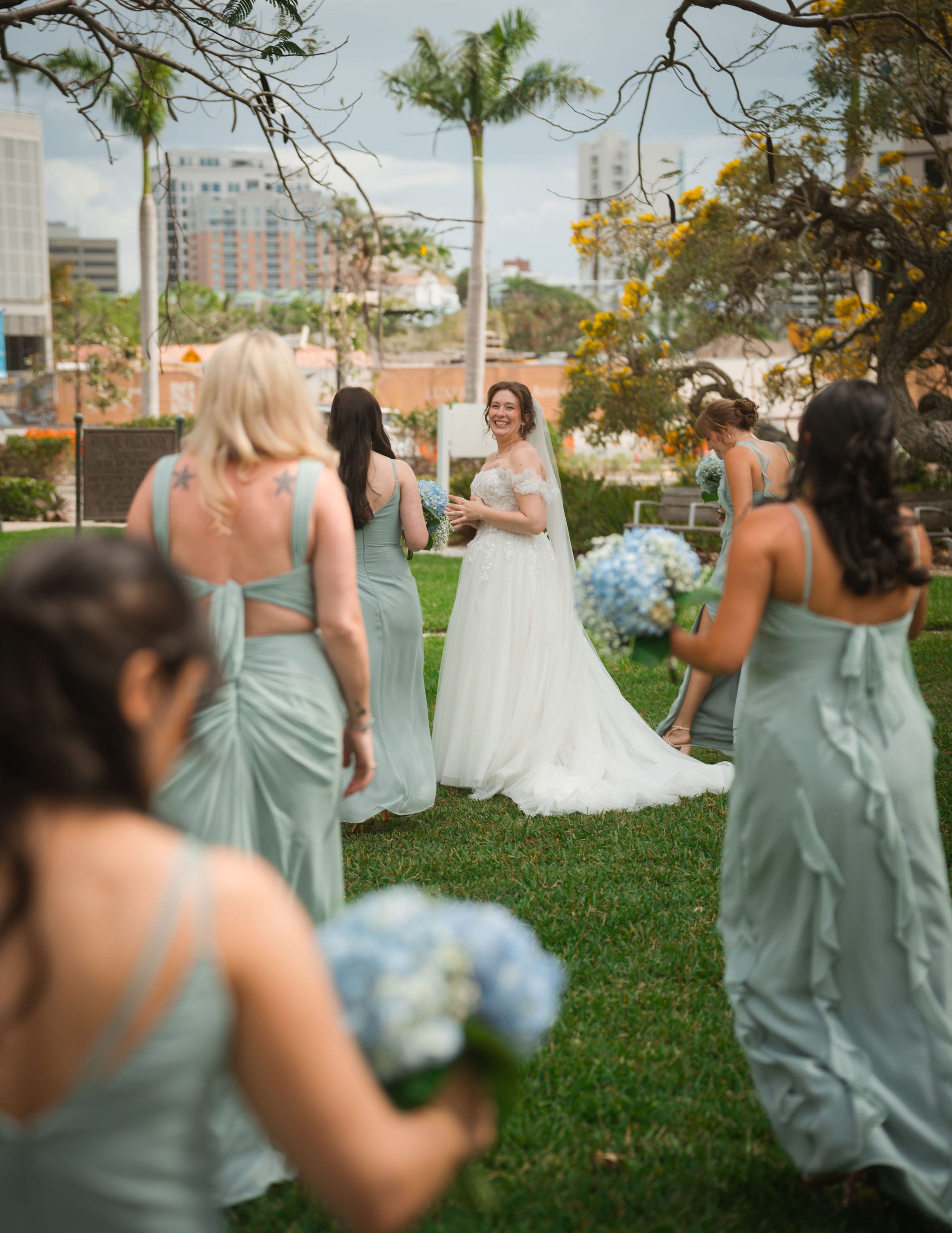 Bride looking back bridesmaids tampa skyline