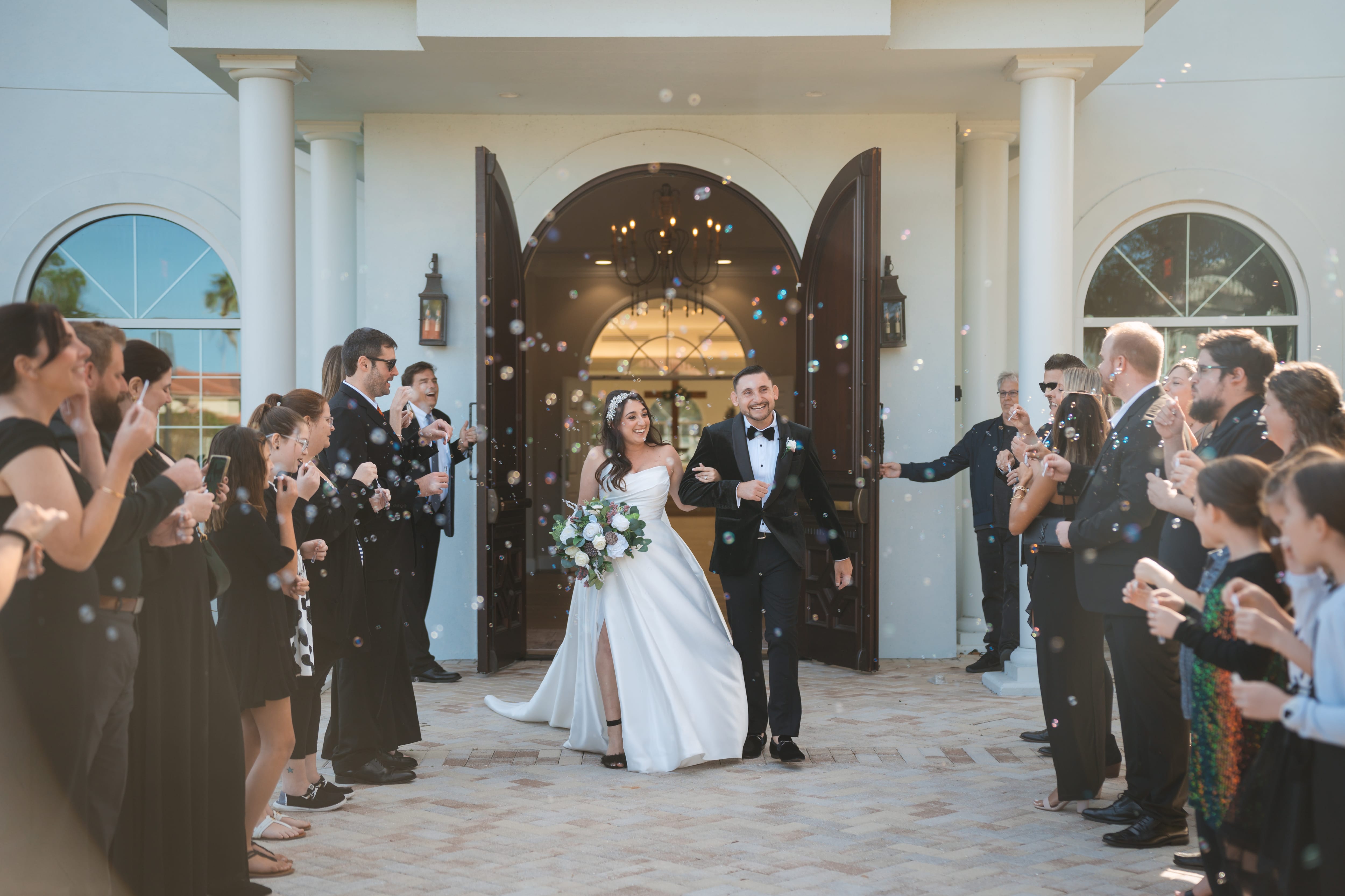 Newlyweds bubble exit white chapel