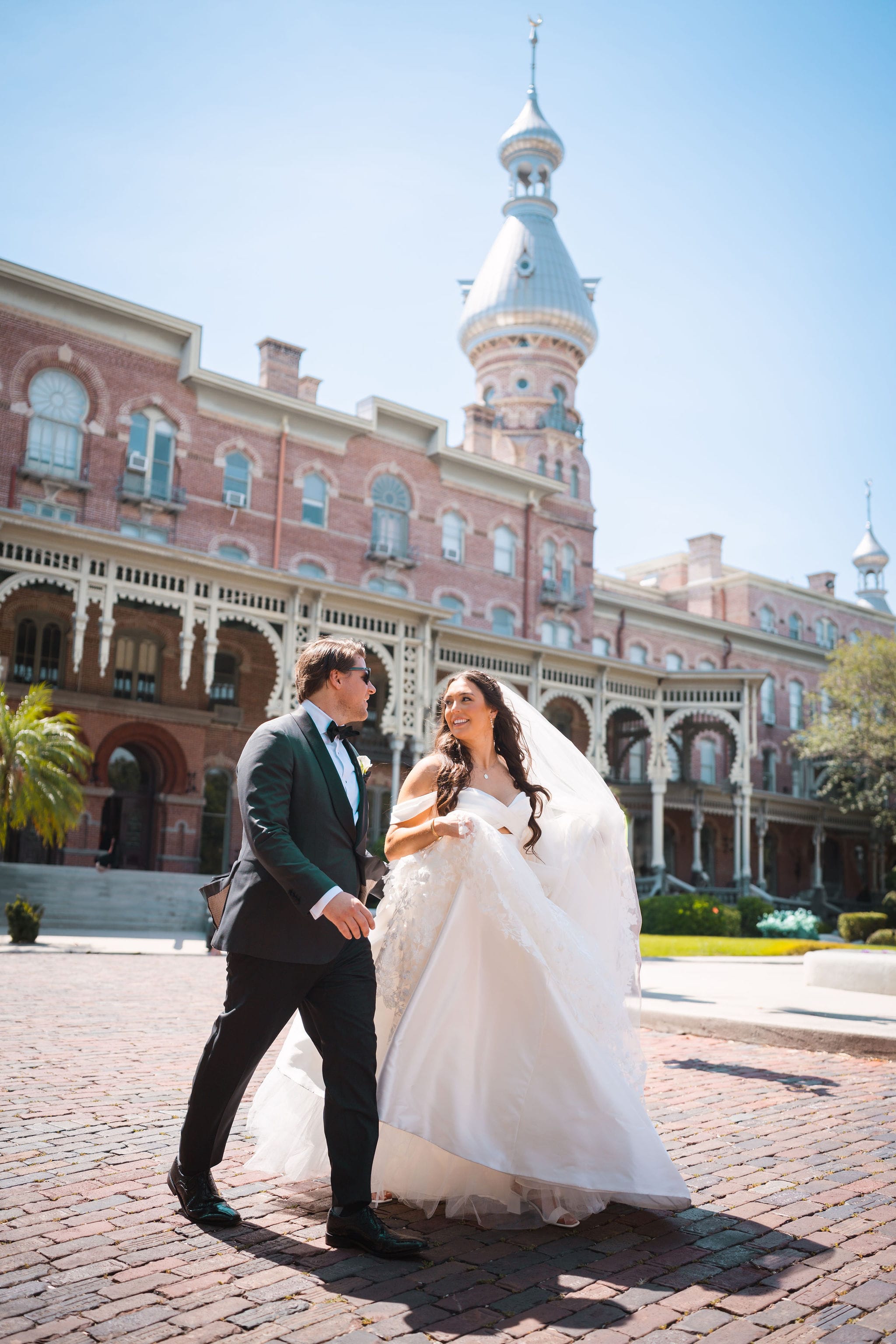 Couple crossing street university of tampa minarets