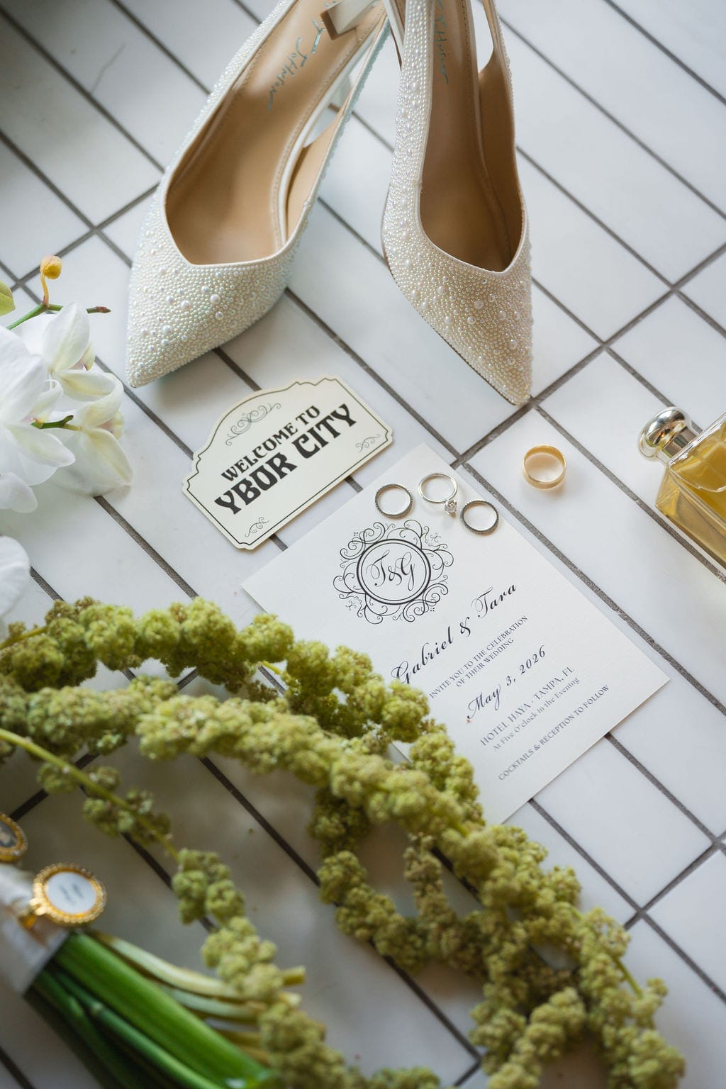 Wedding details flat lay rings shoes invitation Ybor city
