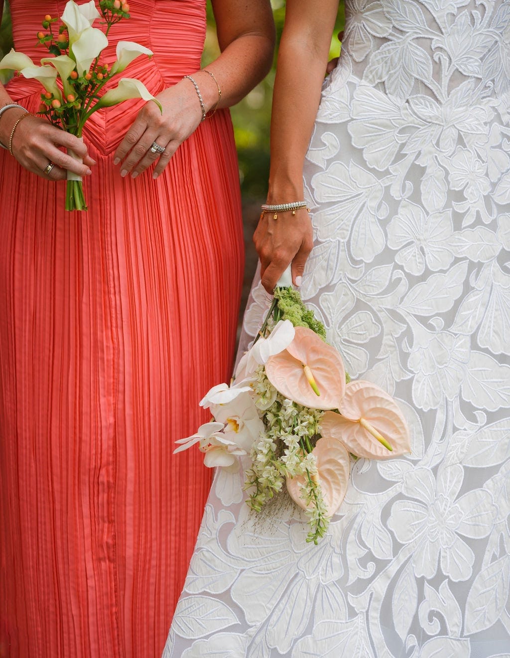 Bride and bridesmaid bouquets anthurium orchids lace gown