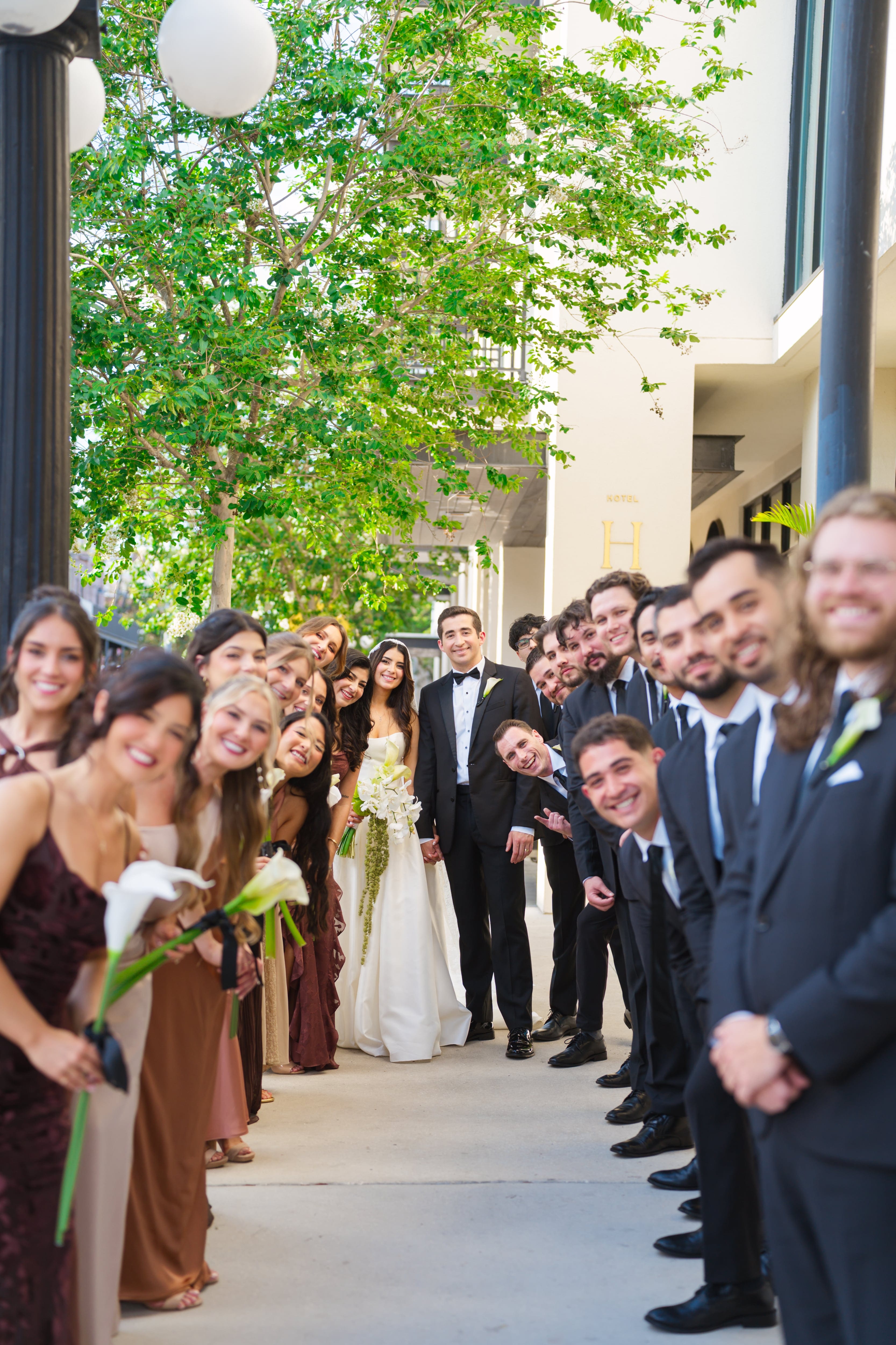 Wedding party lining sidewalks newlyweds ybor city tampa