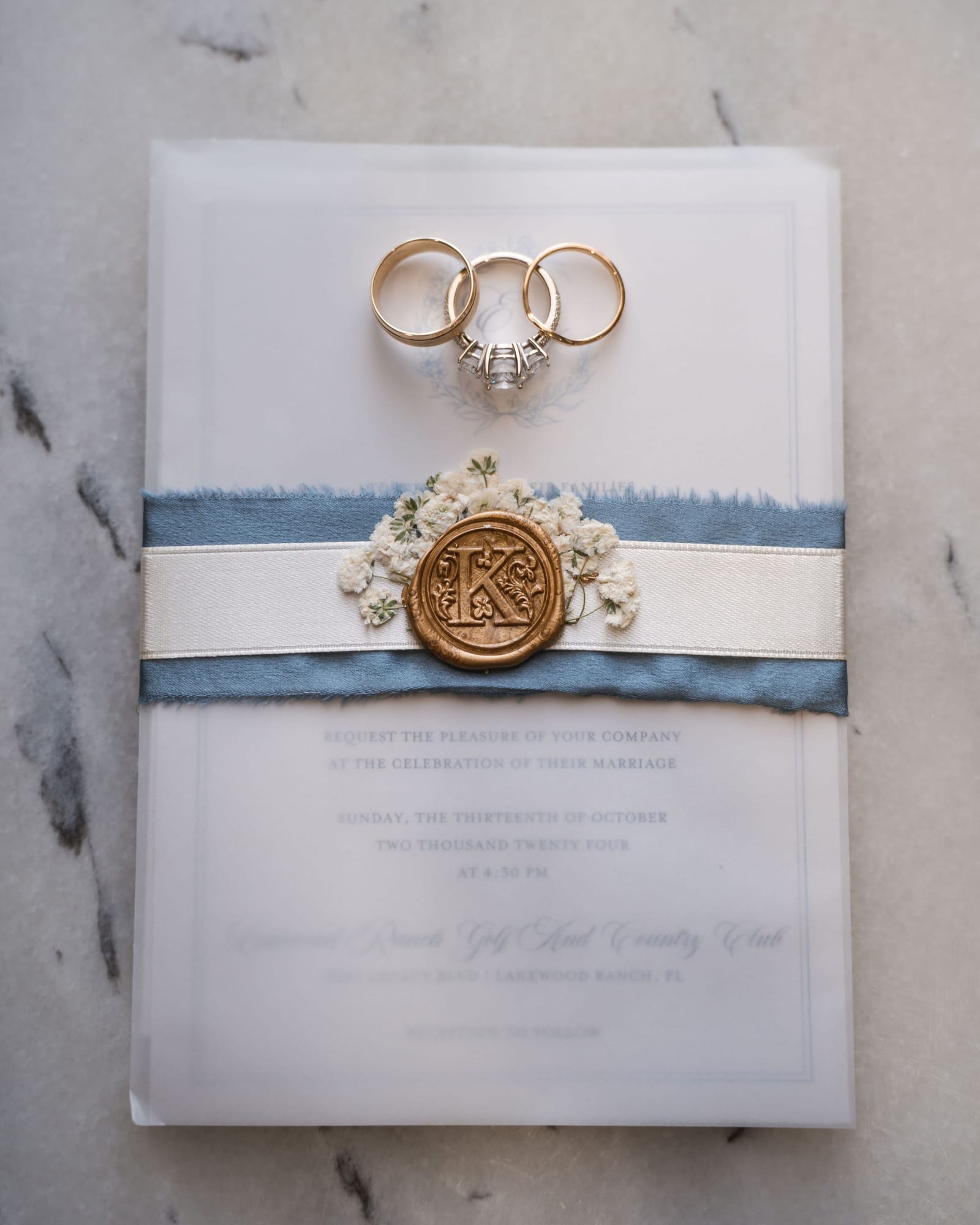 Wedding invitation suite with a gold wax seal for a Lakewood Ranch Golf and Country Club wedding