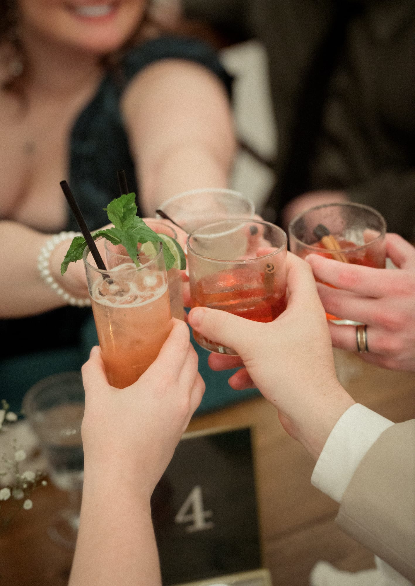 Guests raising cocktails together at the reception